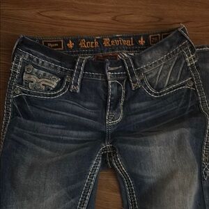 Size 26 like new Mid Rise Boot Cut